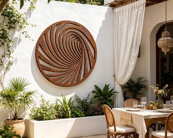 May include: A circular wall art piece featuring a rust-colored metal finish with a deep, spiraling vortex pattern. The design consists of radiating slats that create an optical illusion of depth, mounted on a plain white exterior wall surface.