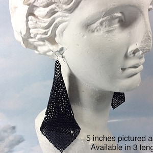 May include: Black mesh dangle earrings, 5 inches long. Available in 3 lengths.