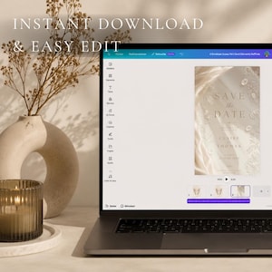 May include: A laptop screen displaying a digital Save the Date template with elegant floral graphics and the text Save the Date, Claire & Thomas, 21 June 2025. The interface shows editing tools, a timeline, and a preview of the invitation design.