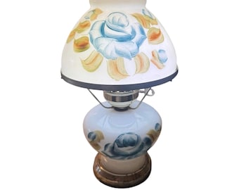 Vintage electric milk glass hurricane parlor lamp featuring hand-painted blue floral designs.