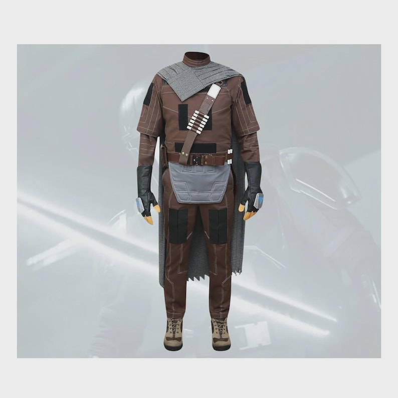May include: A brown and gray costume set featuring a long-sleeved shirt, matching trousers, a gray cape, black gloves with blue accents, a brown utility belt with a bandolier, and a gray loincloth panel. The outfit includes tan lace-up boots.