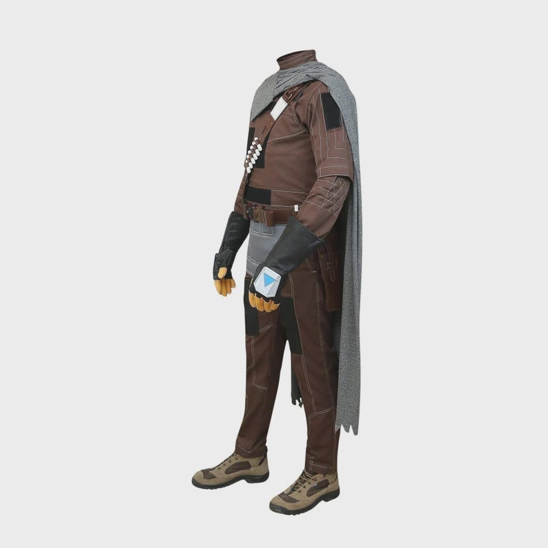 May include: A brown long-sleeved jumpsuit with a grey textured cape, black gloves with blue accents, and tan tactical boots. The outfit includes a brown utility belt, a chest harness with white cylindrical details, and dark brown knee patches.