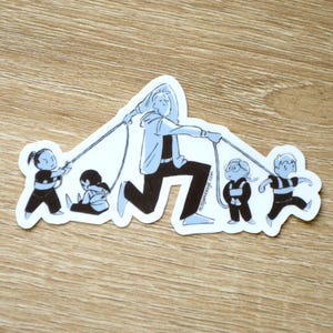May include: A sticker with a cartoon illustration of a person pulling four children on leashes. The person is in black and light blue, and the children are in black. The sticker has the text missjamesage.com.