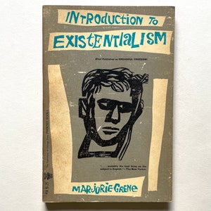 May include: A vintage book cover with a teal and black title "Introduction to Existentialism" with the subtitle "(First Published as Dreadful Freedom)". The cover features a black and white illustration of a man's face with a dark background.
