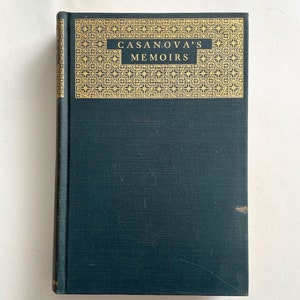 May include: A dark green hardcover book with gold lettering on the spine that reads "CASANOVA'S MEMOIRS". The book has a decorative gold border around the title.