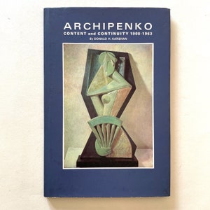 May include: A book titled "Archipenko: Content and Continuity 1908-1963" by Donald H. Karshan. The cover features a colorful abstract sculpture of a woman holding a fan.