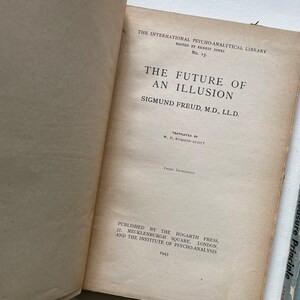 May include: A book titled "The Future of an Illusion" by Sigmund Freud, M.D., LL.D. The book is part of the International Psycho-Analytical Library, edited by Ernest Jones. The book was published in 1943 by the Hogarth Press and the Institute of Psycho-Analysis.