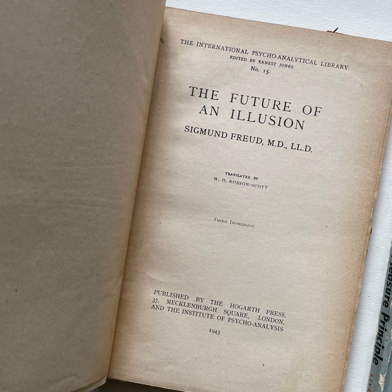 May include: A book titled "The Future of an Illusion" by Sigmund Freud, M.D., LL.D. The book is part of the International Psycho-Analytical Library, edited by Ernest Jones. The book was published in 1943 by the Hogarth Press and the Institute of Psycho-Analysis.