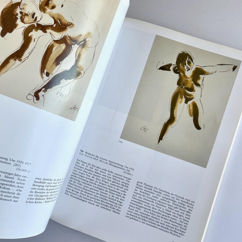 May include: Two black and white sketches of nude figures. The figures are drawn in a loose, gestural style. The sketches are on a white background.