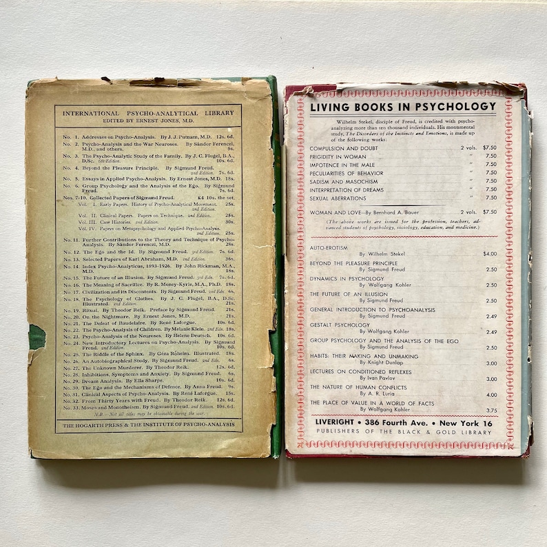 May include: A vintage book cover with a red spine and a green cover. The title of the book is "International Psycho-Analytical Library" and the subtitle is "Edited by Ernest Jones, M.D.". The cover lists the titles and authors of various books on psychoanalysis. The book cover is from the Hogarth Press and the Institute of Psycho-Analysis.