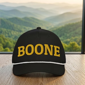 BOONE embroidered classic rope cap. Black North Carolina city hat with gold embroidery.