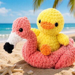 May include: A crochet plush toy featuring a bright yellow duckling sitting inside a pink flamingo-shaped floatie. The duckling has black eyes and an orange beak, while the flamingo has a white and black beak and a textured, soft yarn finish.