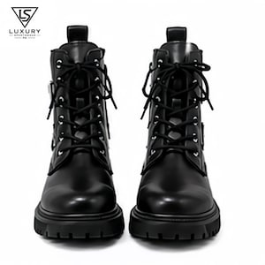 May include: A pair of black lace-up boots featuring a smooth finish, silver-toned eyelets, and thick lug soles. The boots include a pull tab at the heel and black laces. The logo for Luxury Sportswear PK is visible in the upper left corner.