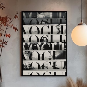 May include: A rectangular black-framed wall art print featuring a collage of multiple Vogue Italia magazine covers stacked horizontally. The artwork displays the bold black and white typography of the Vogue logo repeated across several distinct sections.