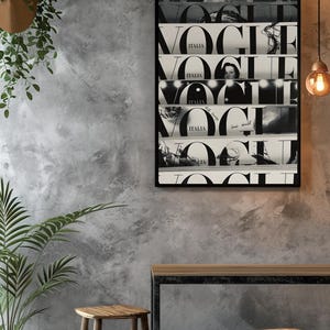 May include: A rectangular black-framed wall art print featuring a collage of five horizontal strips, each displaying the word VOGUE in large black serif typography and the word ITALIA in smaller letters, set against alternating black and white backgrounds.