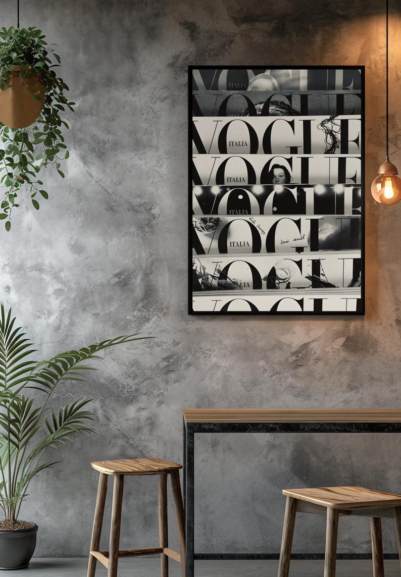 May include: A rectangular black-framed wall art print featuring a collage of five horizontal strips, each displaying the word VOGUE in large black serif typography and the word ITALIA in smaller letters, set against alternating black and white backgrounds.