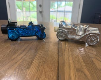 Vintage Avon Glass Car Decanter Set - 1970s Cobalt Blue Dune Buggy & May 1978 Silver Stanley Steamer - 2 Piece Empty Vehicle Bottle Lot