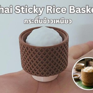 May include: A brown, cylindrical, lattice-patterned Thai Sticky Rice Basket with a white, textured, rounded top. The text "Thai Sticky Rice Basket" and Thai script are visible above the object. A circular inset shows a similar basket with rice.