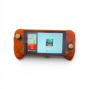 May include: An orange handheld gaming console with a screen displaying a game interface. The console has buttons and joysticks on either side. The screen shows the game "Vampire Crawlers" and "Featured News".
