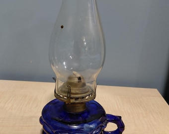 Vintage miniature cobalt blue glass oil lamp embossed.