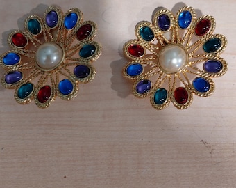 Vintage round gold-tone clip on earrings with central faux pearl surrounded with multi-colored lucite stones