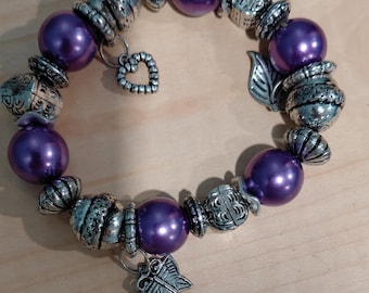 Vintage purple and silver toned beaded bracelet with charms