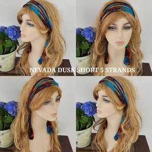 May include: A multi-colored crocheted headband with five strands of yarn in shades of blue, purple, orange, and brown. The headband is shown on a model with long blonde hair. The text "NEVADA DUSK SHORT 5 STRANDS" is visible in the image.