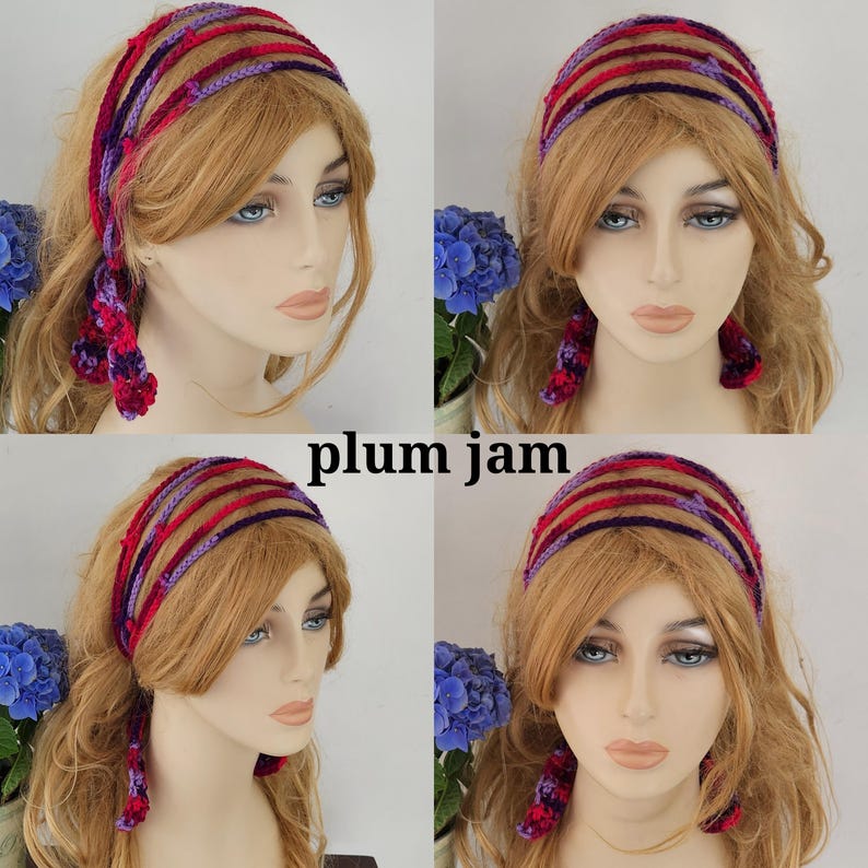 May include: A purple and red crocheted headband with a knotted design. The headband is worn by a mannequin with long blonde hair.