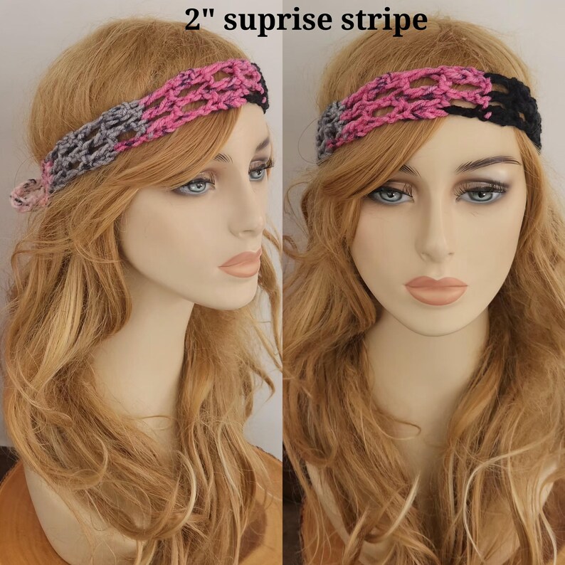 May include: A 2-inch wide crochet headband featuring a variegated pink and black yarn pattern with a grey section on one side and a solid black section on the other. The open-weave design is displayed on a mannequin head with long blonde hair.