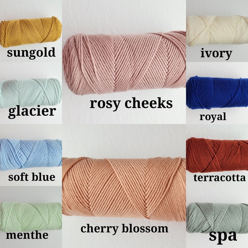 May include: A collection of yarn skeins in various colors, including sungold, glacier, soft blue, menthe, rosy cheeks, cherry blossom, ivory, royal, terracotta, and spa.