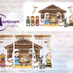 May include: A clear glass tumbler with a bamboo lid featuring a cartoon nativity scene with Mary, Joseph, baby Jesus, three wise men, sheep, a donkey, and two angels, alongside Charlie Brown and Snoopy, with the MarCourt Transfers logo visible.