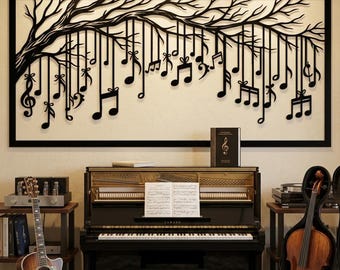 May include: A rectangular black metal wall art piece featuring a tree branch with hanging musical notes and bows. Below, an upright piano with sheet music, a brown acoustic guitar on a stand, and a cello in a case are positioned in a room.