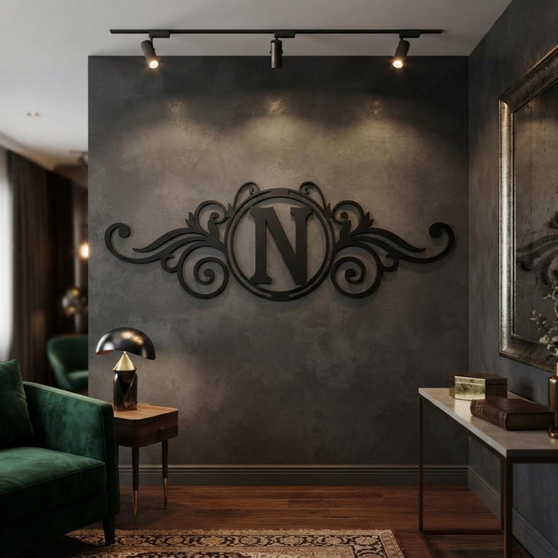 May include: A black wall-mounted sign featuring a central circular frame containing the capital letter N, flanked by symmetrical decorative scrollwork. The piece is constructed with a flat, matte finish and is mounted on a dark grey wall.
