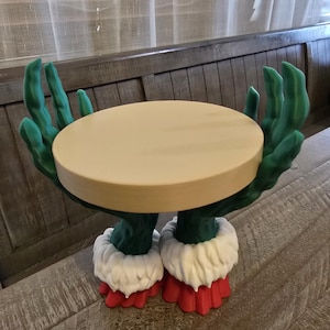 Portavelas con temática del Grinch