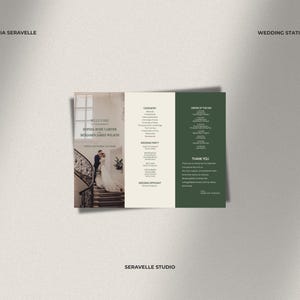 May include: A tri-fold wedding program featuring a photograph of a couple on a staircase on the left panel, with ceremony details, wedding party names, and an order of the day printed in dark text on cream and dark green background panels.