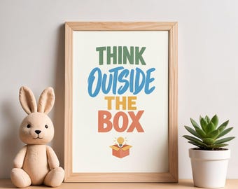 May include: A framed wall art print featuring the text THINK in green, OUTSIDE in blue, THE in yellow, and BOX in orange, with a small lightbulb icon above an open cardboard box. A plush tan rabbit and a green succulent in a white pot.