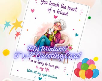 May include: A 5" x 7" greeting card featuring an illustration of a person with grey hair sitting in a chair holding a mug that says Best Friend Ever. The text reads You touch the heart of a friend, I'm so lucky to have you in my life, and With all my appreciation.