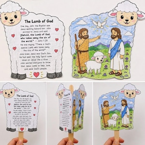 May include: A paper craft shaped like a lamb featuring the text The Lamb of God and John 1:29. One side displays a colored illustration of John the Baptist, Jesus, a white lamb, and a dove. The craft is attached to a wooden stick handle.