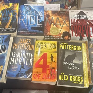 May include: A collection of nine James Patterson novels including titles such as Saving the World, Maximum Ride, Max, Maximum Ride Forever, Murder Island, The 13-Minute Murder, 4th of July, Deadly Cross, and The Summer House with various cover art.