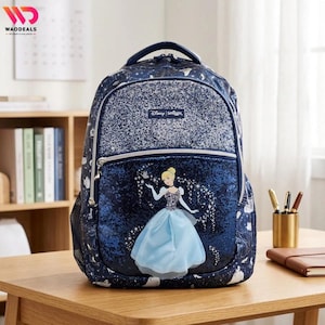 May include: A dark blue backpack featuring a glittery top panel and a graphic of Cinderella in a light blue gown on the front pocket. The bag has a starry pattern, silver zippers, and a small rectangular label with the text Disney Smiggle.