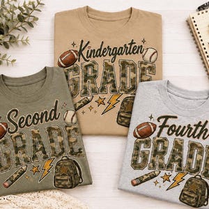 Three t-shirts with the text "Second Grade" printed on them, along with various sports-related icons such as a football, baseball, and a backpack.
