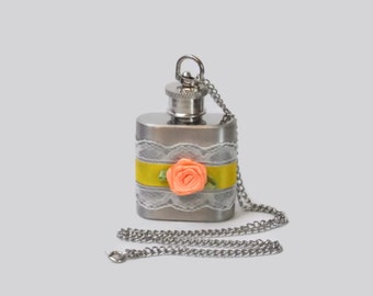 Flask Necklace 1oz flask with delicate white lace, yellow satin ribbon, and peach satin flower