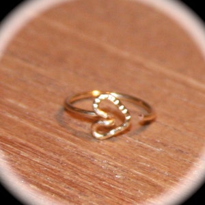 This item is a heart nose ring or cartilage earring. It is a handmade hoop style piercing that is also called an endless hoop or seamless hoop. A customer favorite!