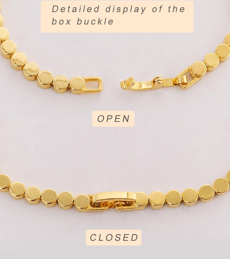 May include: A gold-toned chain bracelet composed of small, flat, circular links. The image displays two views: one with the box buckle in an open position labeled "OPEN" and one with the buckle in a closed position labeled "CLOSED". Text reads "Detailed display of the box buckle".