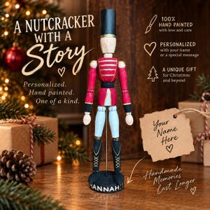 May include: A wooden nutcracker figurine featuring a black hat, red jacket with gold stripes, light blue trousers, and black boots. The base is inscribed with the name HANNAH. Text on the image includes A NUTCRACKER WITH A STORY and Your Name Here.