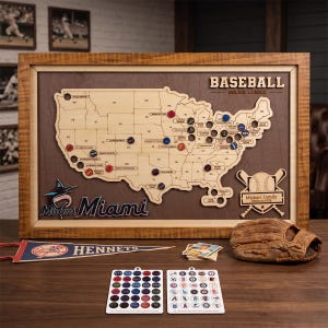 May include: A framed wooden map of the United States featuring the text BASEBALL MAJOR LEAGUE, a Miami logo, and a Michael Family Stadium Map plaque. The map includes circular markers, a baseball glove, a pennant, and two sheets of team logo stickers.