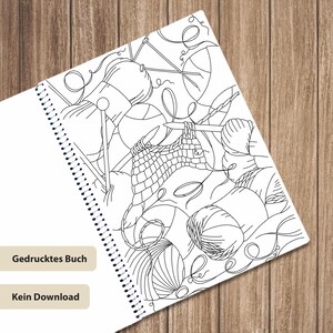 May include: A spiral-bound coloring book page featuring black and white line art of multiple yarn balls and knitting needles. The page includes the German text "Gedrucktes Buch" and "Kein Download" printed on two separate beige rectangular labels.