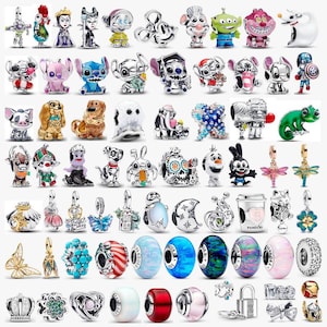 May include: A collection of various metal and enamel charms featuring characters, animals, and abstract shapes. The assortment includes colorful figures, sparkling beads, and detailed pendants, all designed for attachment to bracelets or necklaces.