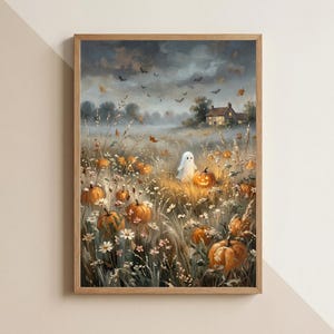 May include: A framed wall art print depicting a field of orange pumpkins and white daisies under a dark, cloudy sky. A small white ghost stands among the pumpkins, with a house in the distance and silhouettes of flying bats overhead.