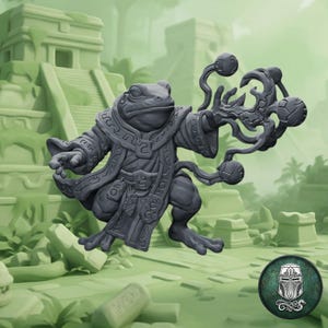 May include: A dark gray miniature figurine of an anthropomorphic frog wizard wearing ornate robes with intricate patterns. The figure holds a magical staff-like object with floating spherical elements in one hand and has a dynamic, spell-casting pose.